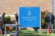 Joe%20Sweere%20in%20front%20of%20clinic%20sign-Thumbnail Image.jpg